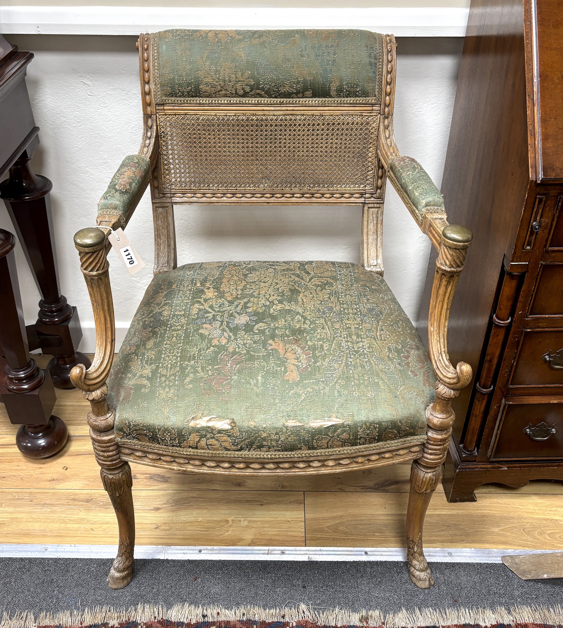 A 19th century oak and canework fauteuil, width 60cm, depth 50cm, height 86cm